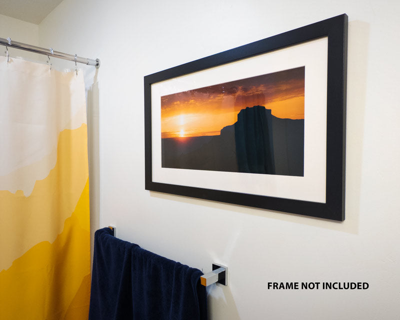 Framed photo of a sunrise over a desert butte in Southern Utah