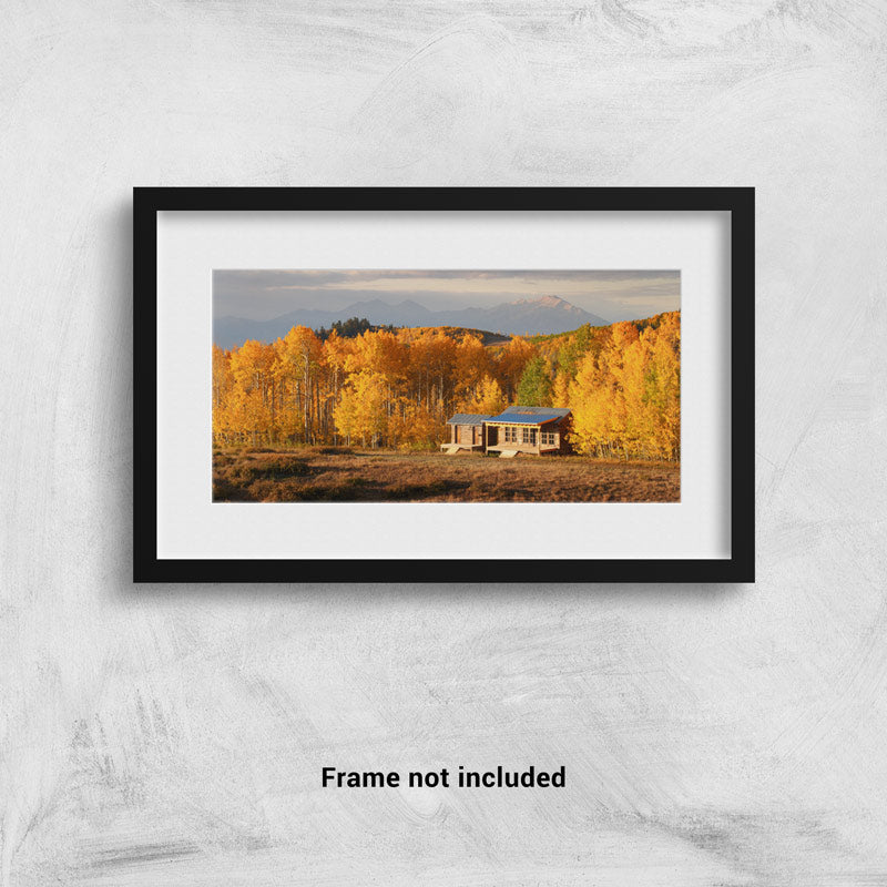 A cabin in the fall in Utah framed on the wall