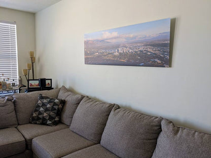 A photo of the Salt Lake Valley hanging on a wall in a living room